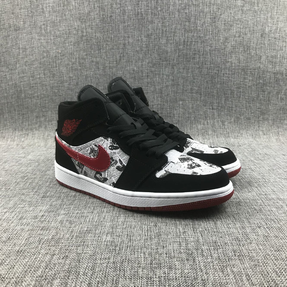 Air Jordan 1 Mid Sneakers in Black Red 852542-061 - product image from the listing.