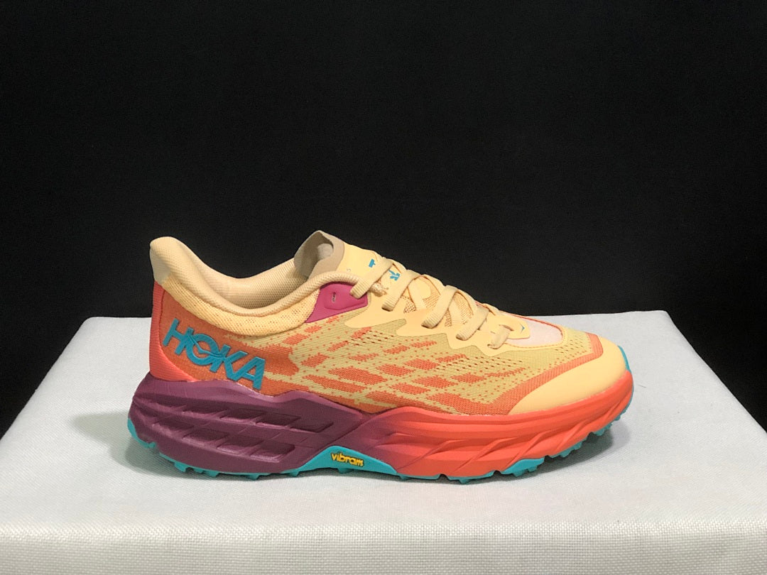 Yellow and Coral HOKA Speedgoat 5 Trail Running Shoes - product image from the listing.
