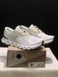 On Cloud X 4 Sneakers in Ivory and Blue - product image from the listing.