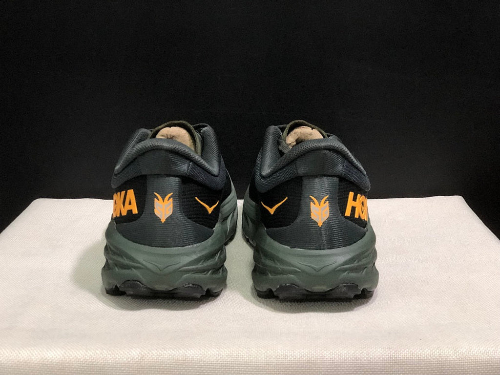 HOKA Speedgoat 5 Trail Running Shoes, in Black and Olive - product image from the listing.