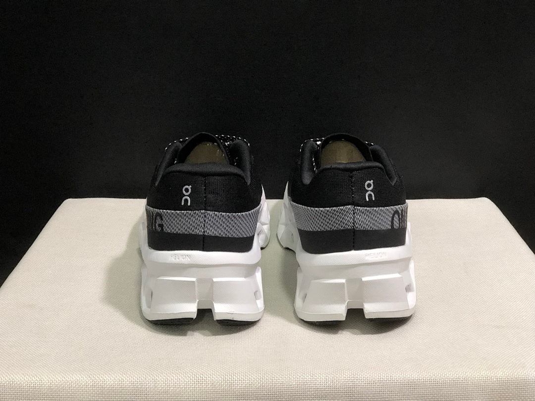 On Cloudmonster 2 Running Shoes in Black White - product image from the listing.