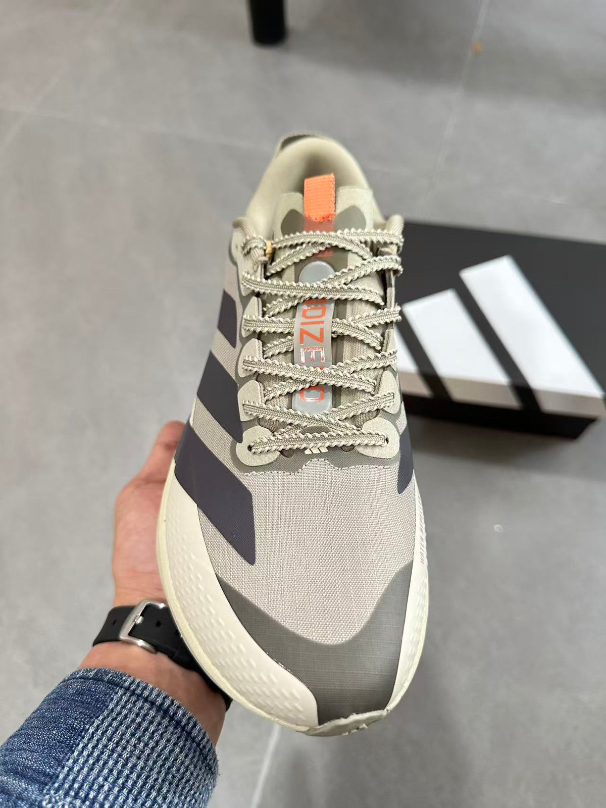 Adidas Adizero Lightstrike Pro Running Shoes, in Cream and Navy - product image from the listing.