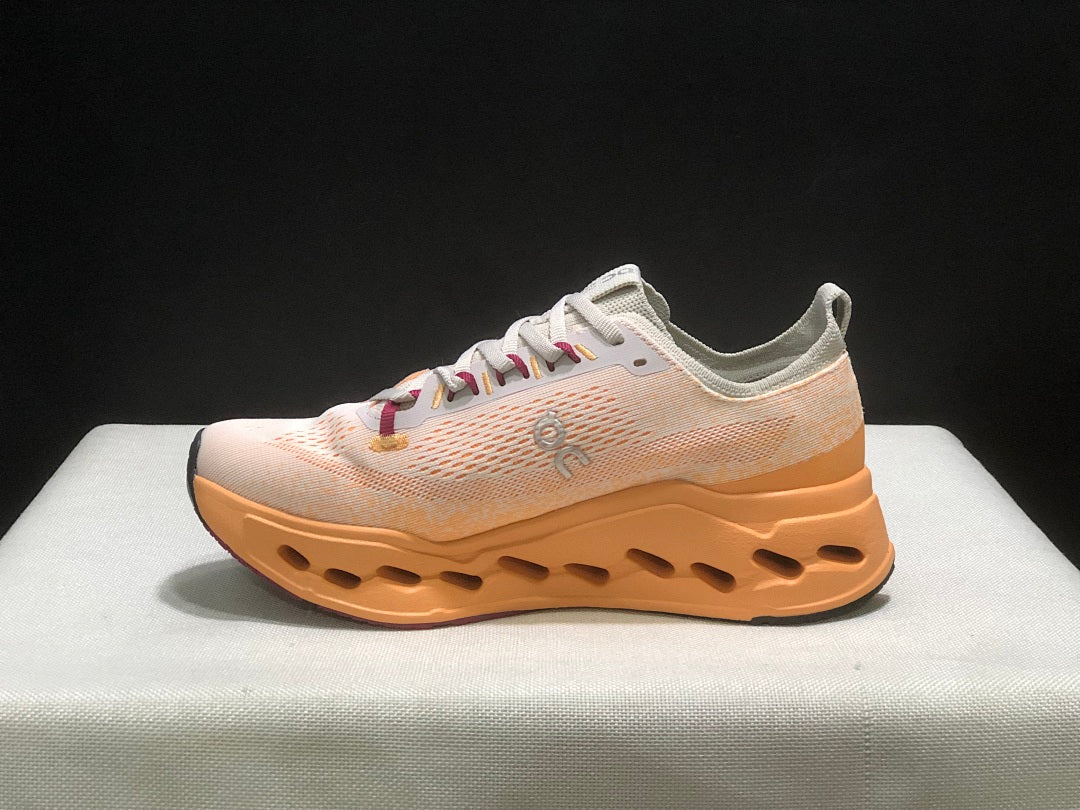 On Cloudsurfer Max Shoes for Running in Pearl and Tangerine - product image from the listing.