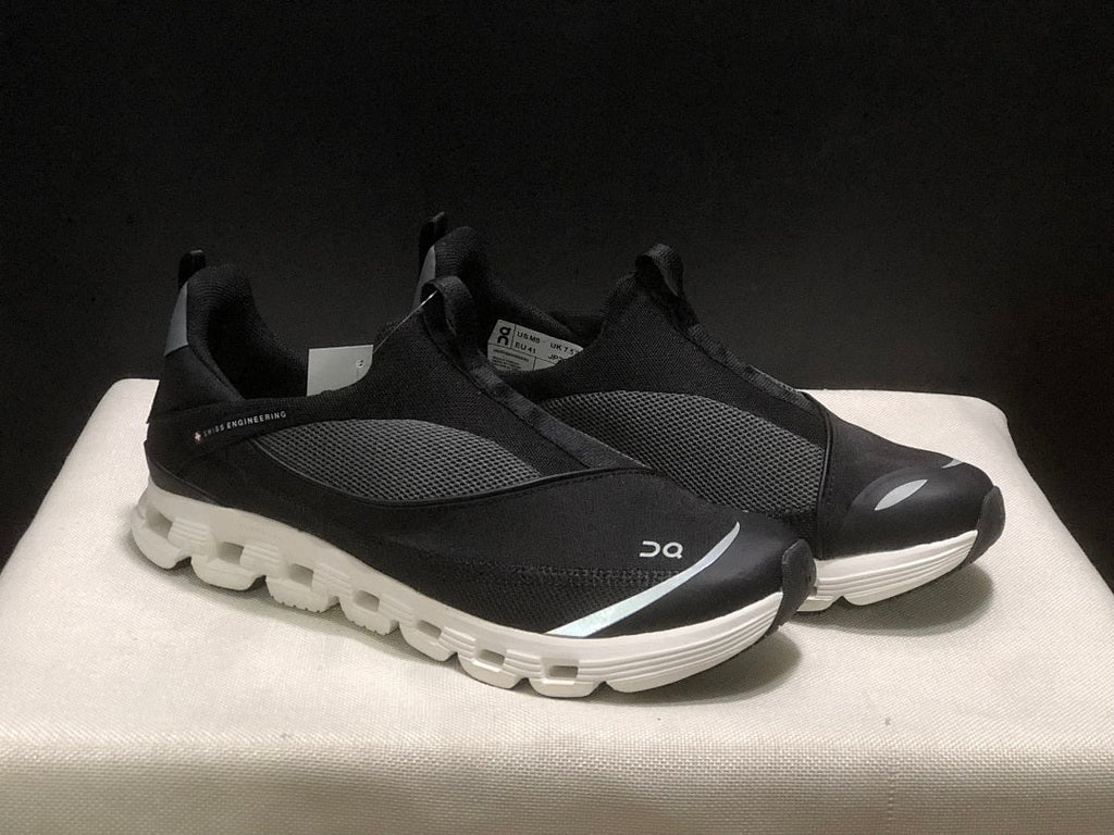 On Cloud X 4 Coast Sneakers in Black and White - product image from the listing.