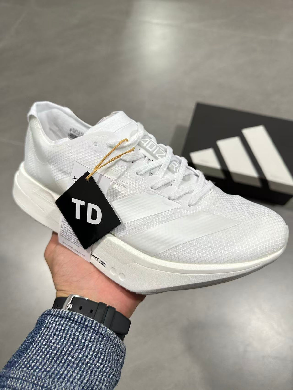Adidas Adizero Lightstrike Pro Running Shoes in White JR6355 - product image from the listing.