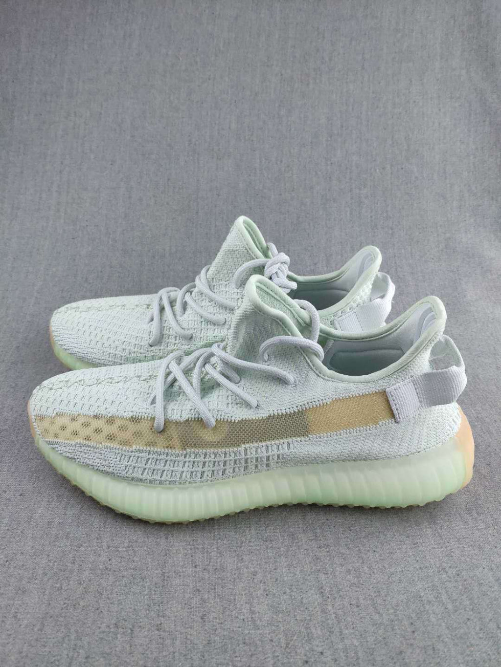White and Tan Yeezy 350 V2 Knit Sneakers - product image from the listing.