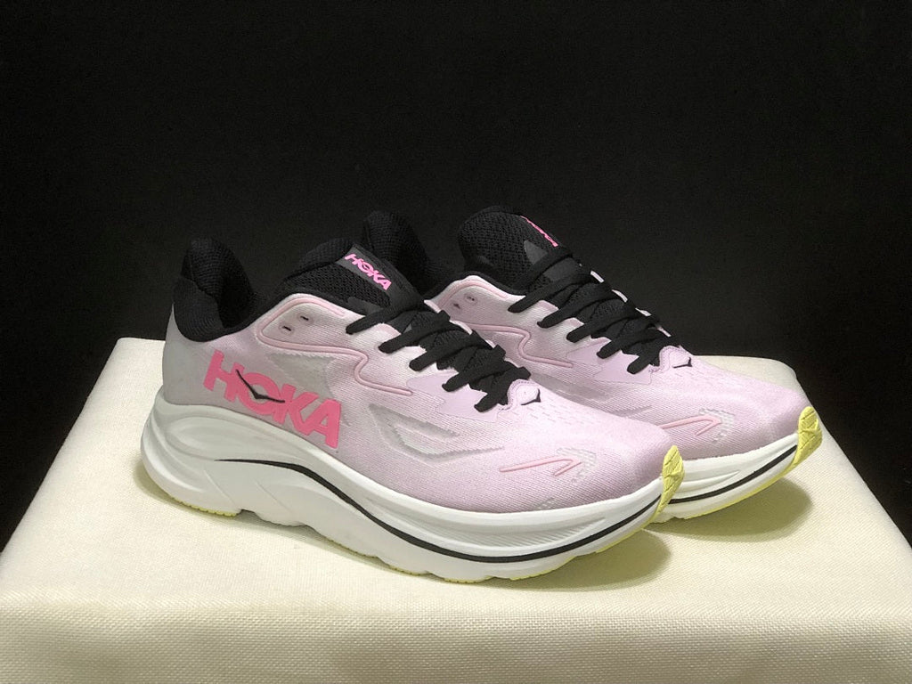 Pink and White HOKA Clifton 10 Running Shoes - product image from the listing.