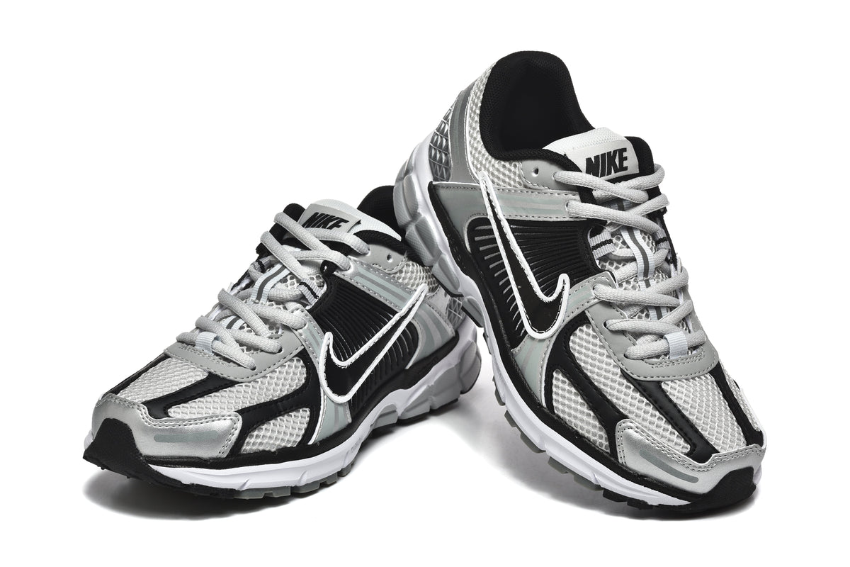 Nike Silver and Black Mesh Trainers - product image from the listing.