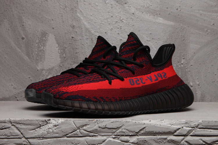 Red and Black Yeezy 350 V2 Knit Sneakers - product image from the listing.