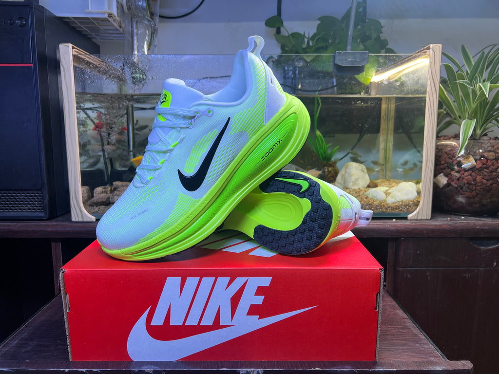 Blue and Volt Green Nike Vomero 18 Running Shoes - product image from the listing.