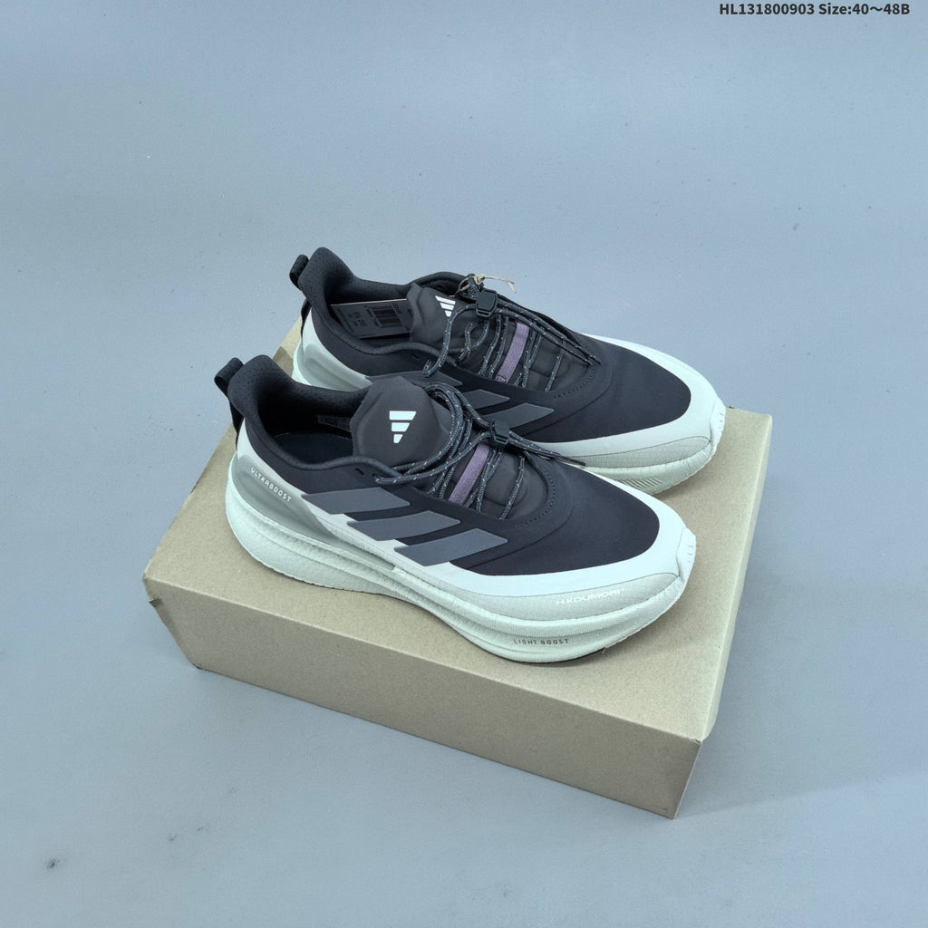 Adidas Ultraboost 5 Running Shoes, in Charcoal and Cream - product image from the listing.