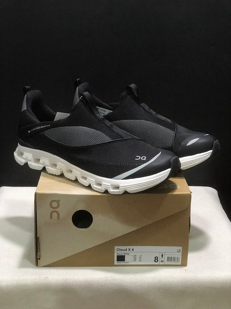 On Cloud X 4 Coast Sneakers in Black and White - product image from the listing.