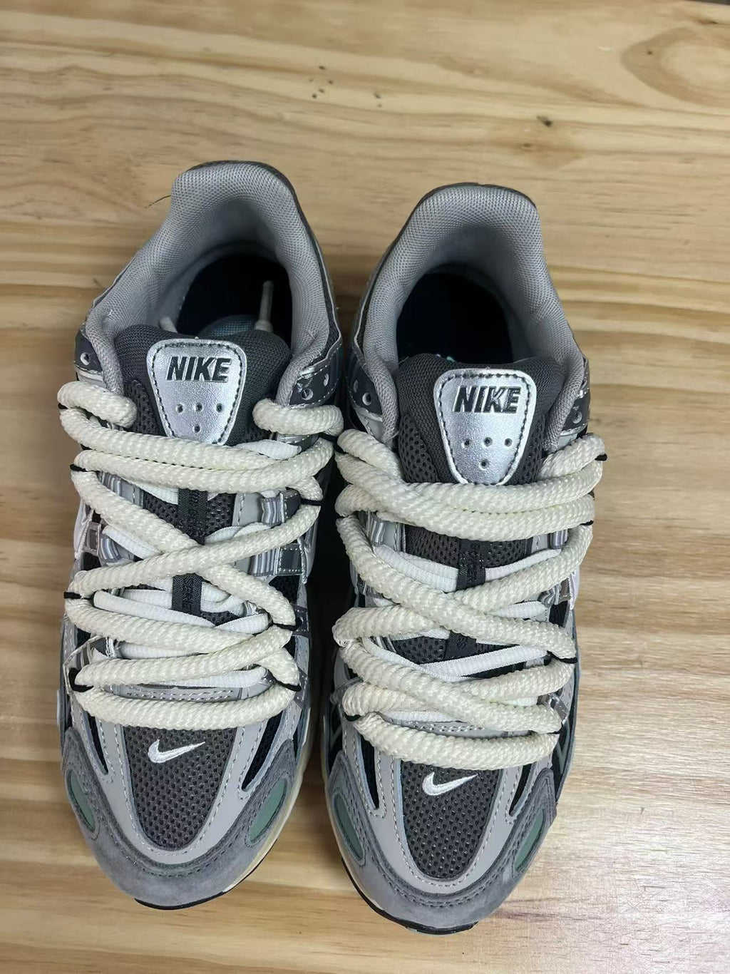 Grey and Black Nike P-6000 Retro Sneakers - product image from the listing.