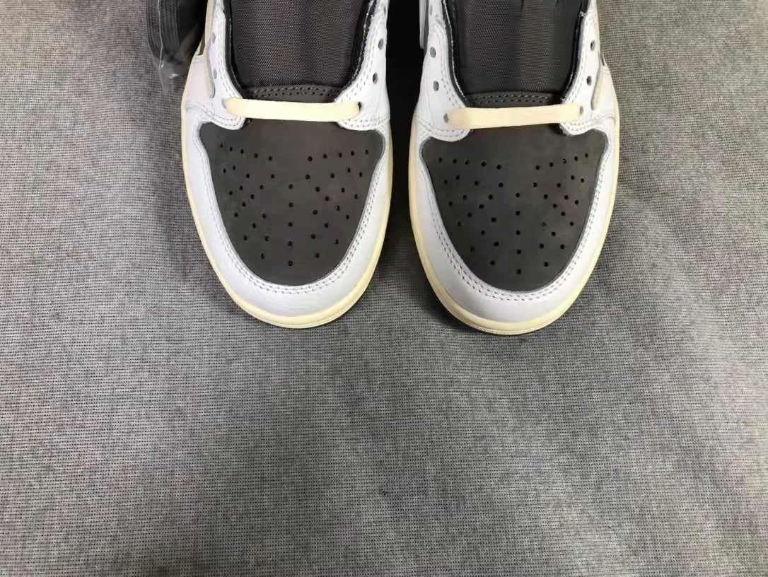 Travis Scott x Air Jordan 1 Low Sneakers in White Brown - product image from the listing.