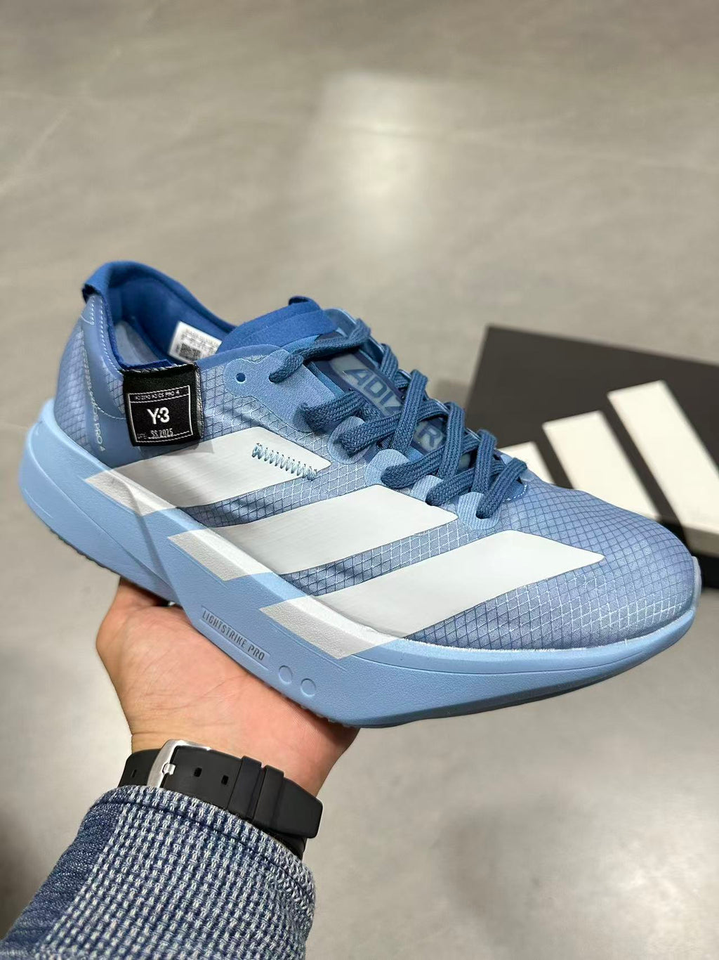 Blue Adidas Lightstrike Pro Running Shoes - product image from the listing.