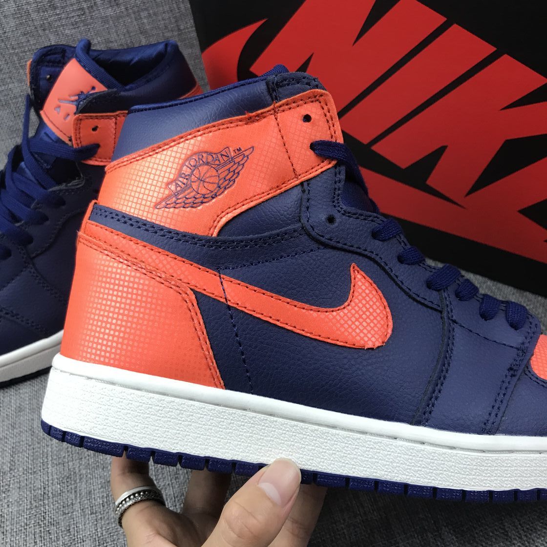 Air Jordan 1 Mid Sneakers in Blue Orange AH7389-408 - product image from the listing.