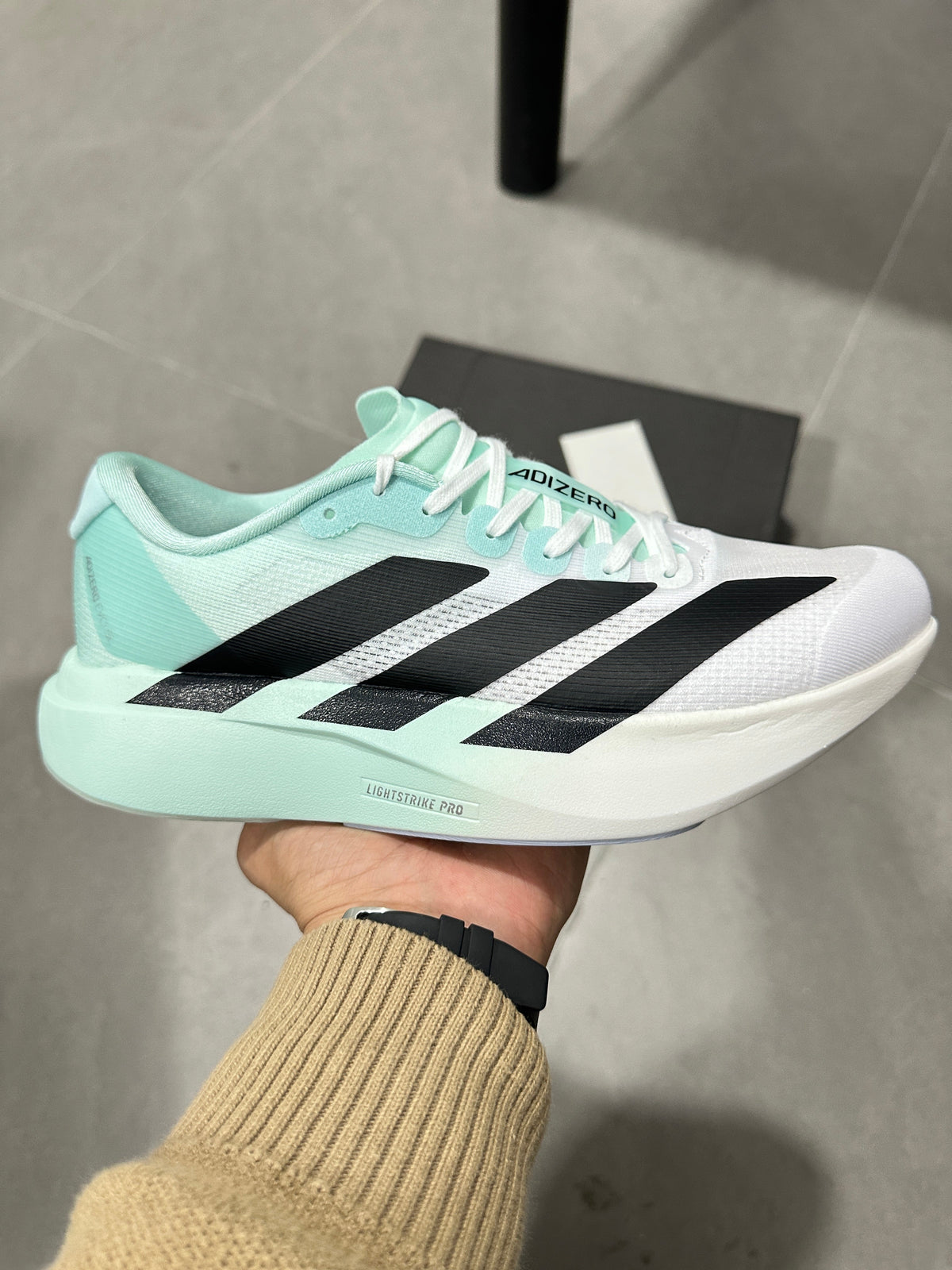 White and Mint adidas Adizero Lightweight Running Shoes - product image from the listing.