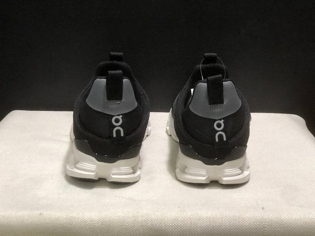On Cloud X 4 Coast Sneakers in Black and White - product image from the listing.