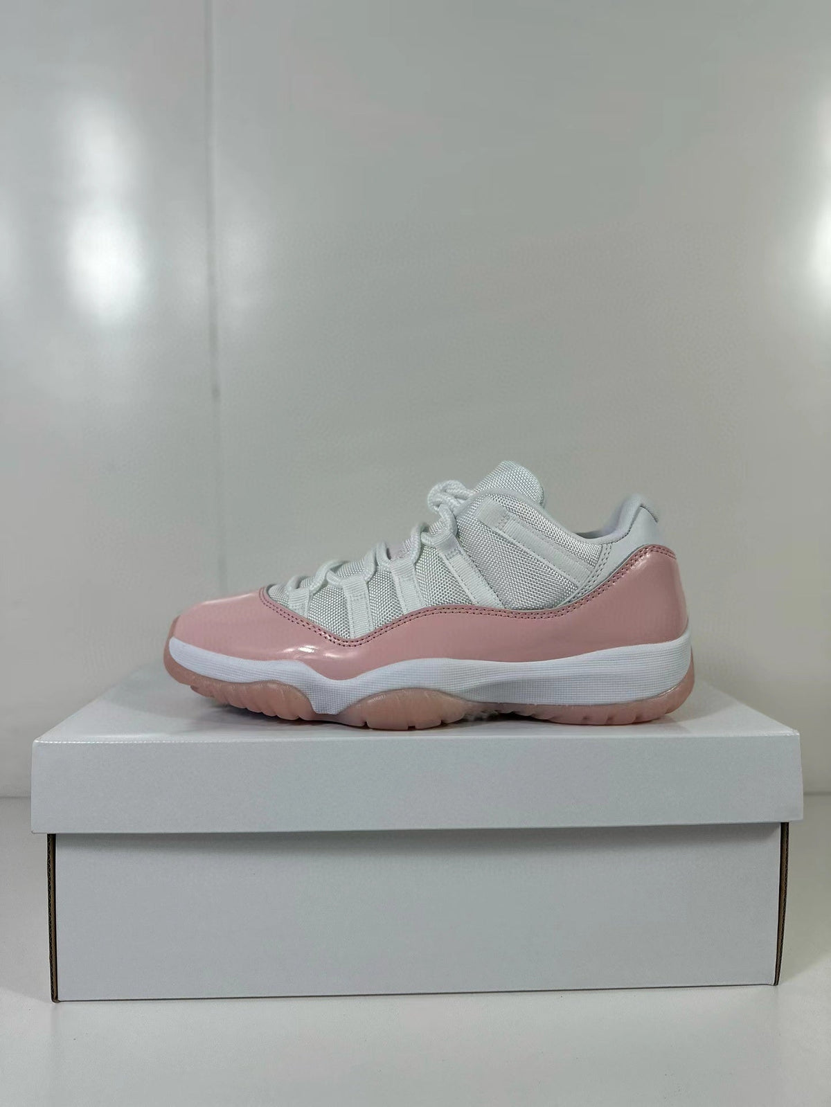 Air Jordan 11 Low Women's Pink Sneakers AH7860-160 - product image from the listing.