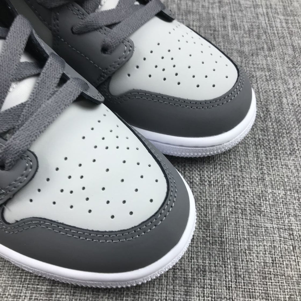Air Jordan 1 Mid Sneakers in Grey Volt 554724-072 - product image from the listing.