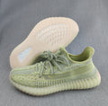Pale Yellow and Gray Yeezy 350 V2 Knit Sneakers - product image from the listing.