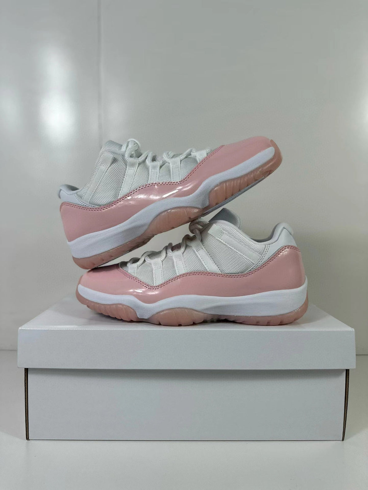 Air Jordan 11 Low Women's Pink Sneakers AH7860-160 - product image from the listing.