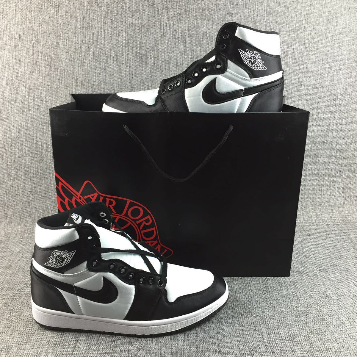 Black and White Satin-Style Sneakers - Air Jordan 1 High - product image from the listing.