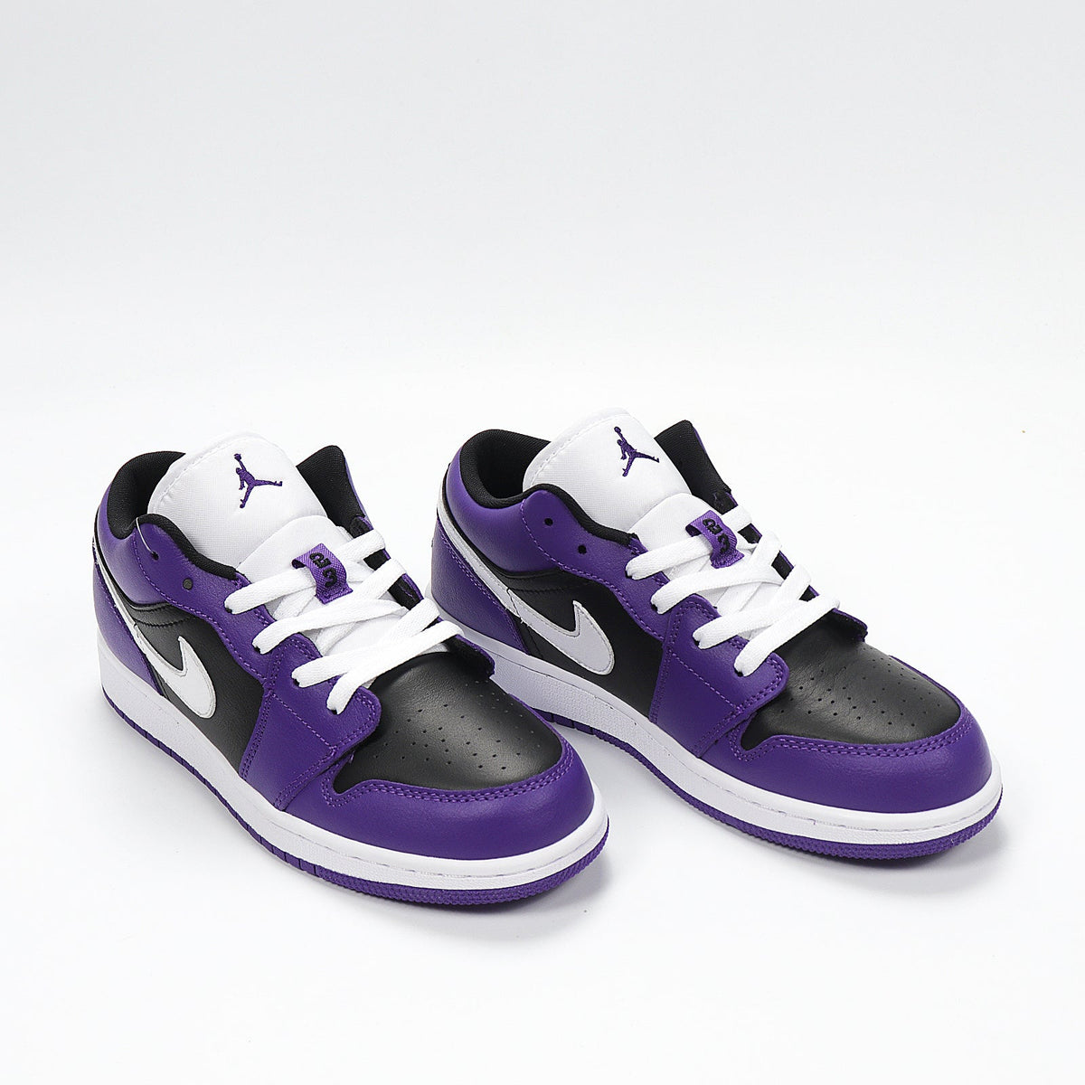 Jordan 1 Low Sneakers in Black Purple White 553560-501 - product image from the listing.