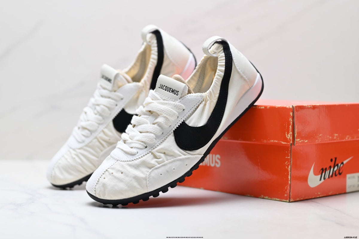 Jacquemus x Nike Jacumoon Low-Top Sneakers, in White and Black - product image from the listing.