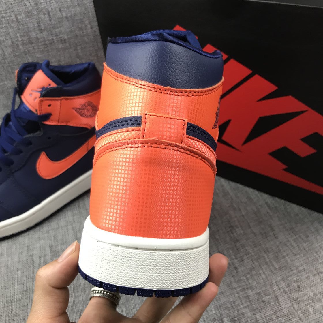 Air Jordan 1 Mid Sneakers in Blue Orange AH7389-408 - product image from the listing.