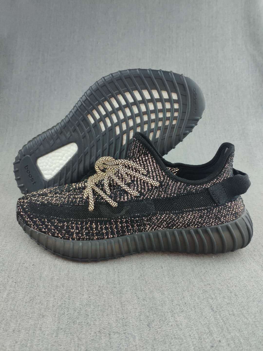 Black and Cream Yeezy 350 V2 Knit Sneakers - product image from the listing.