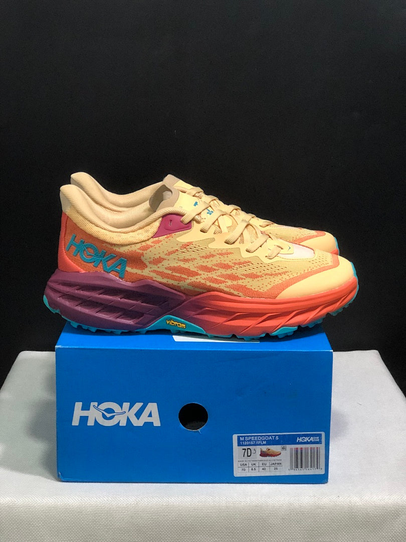 Yellow and Coral HOKA Speedgoat 5 Trail Running Shoes - product image from the listing.