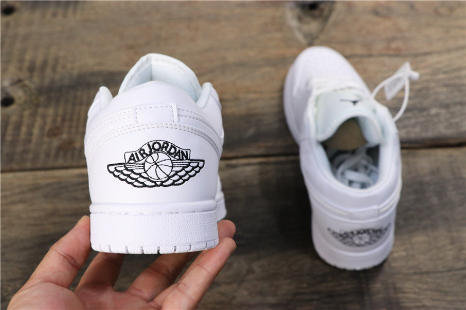 Jordan 1 Low Basketball Sneakers in White 553560-101 - product image from the listing.