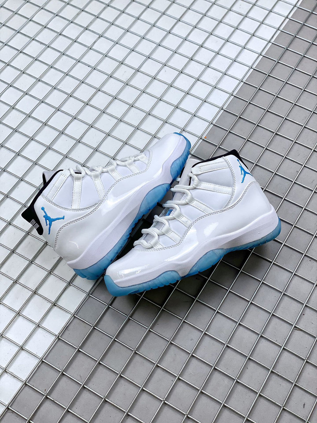 Jordan 11 Legend Blue Sneakers in White Blue 378037-117 - product image from the listing.