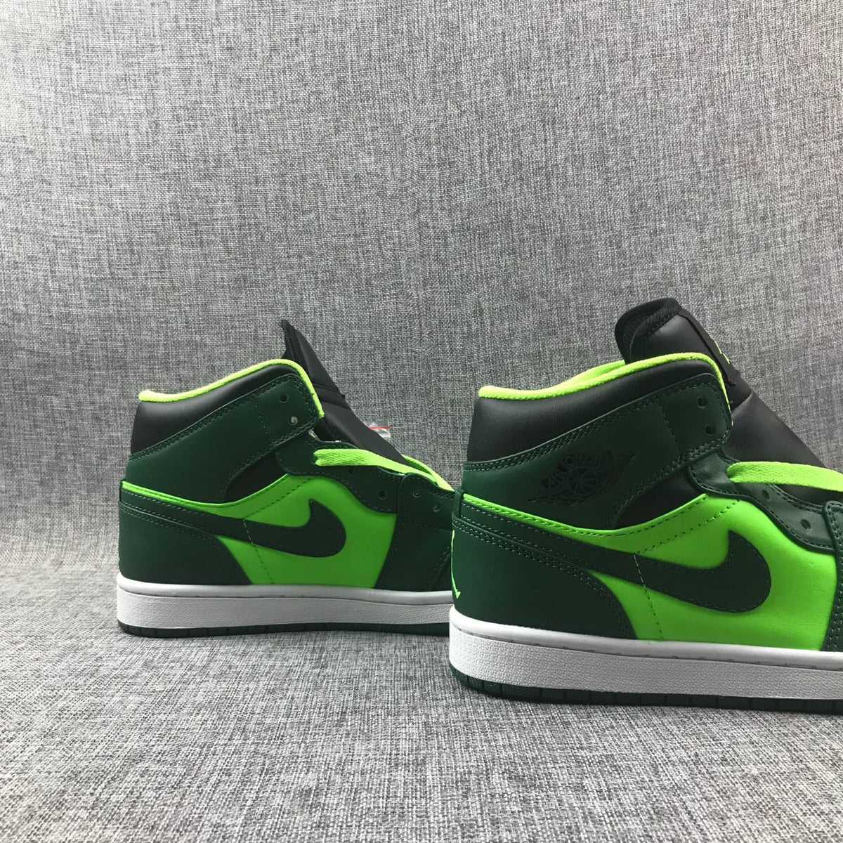 Air Jordan 1 Mid Fluorescent Sneakers in Green 554724-330 - product image from the listing.