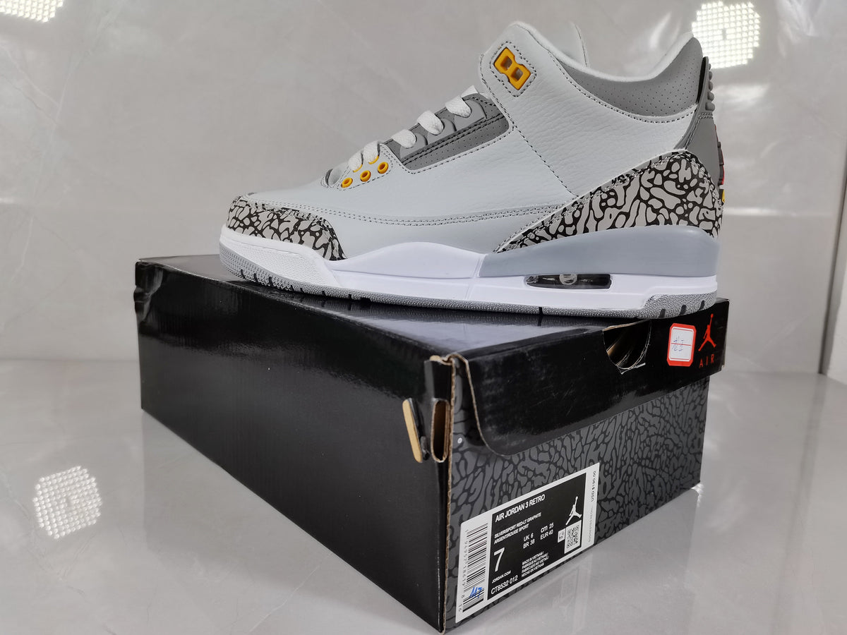 Air Jordan 3 Retro Grey and Orange Sneakers - product image from the listing.
