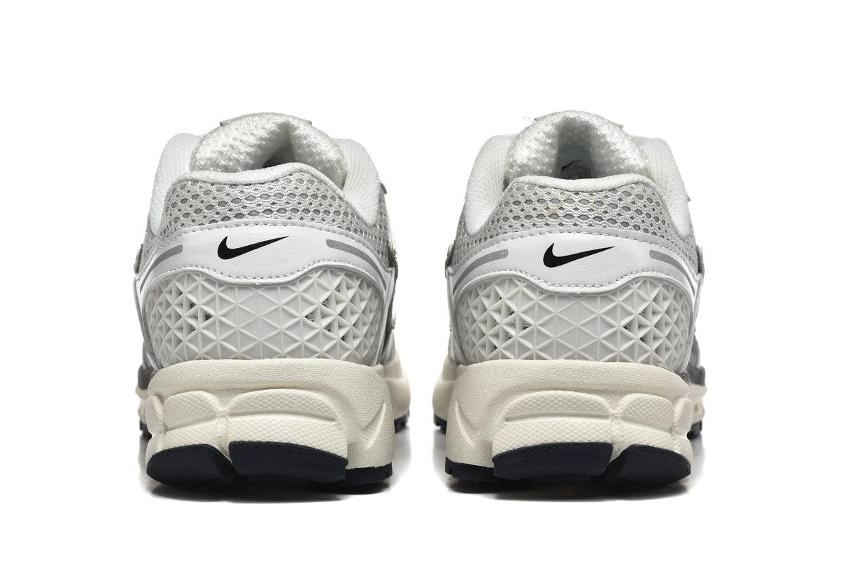 Nike Vomero 5 Sneakers in Silver and White - product image from the listing.