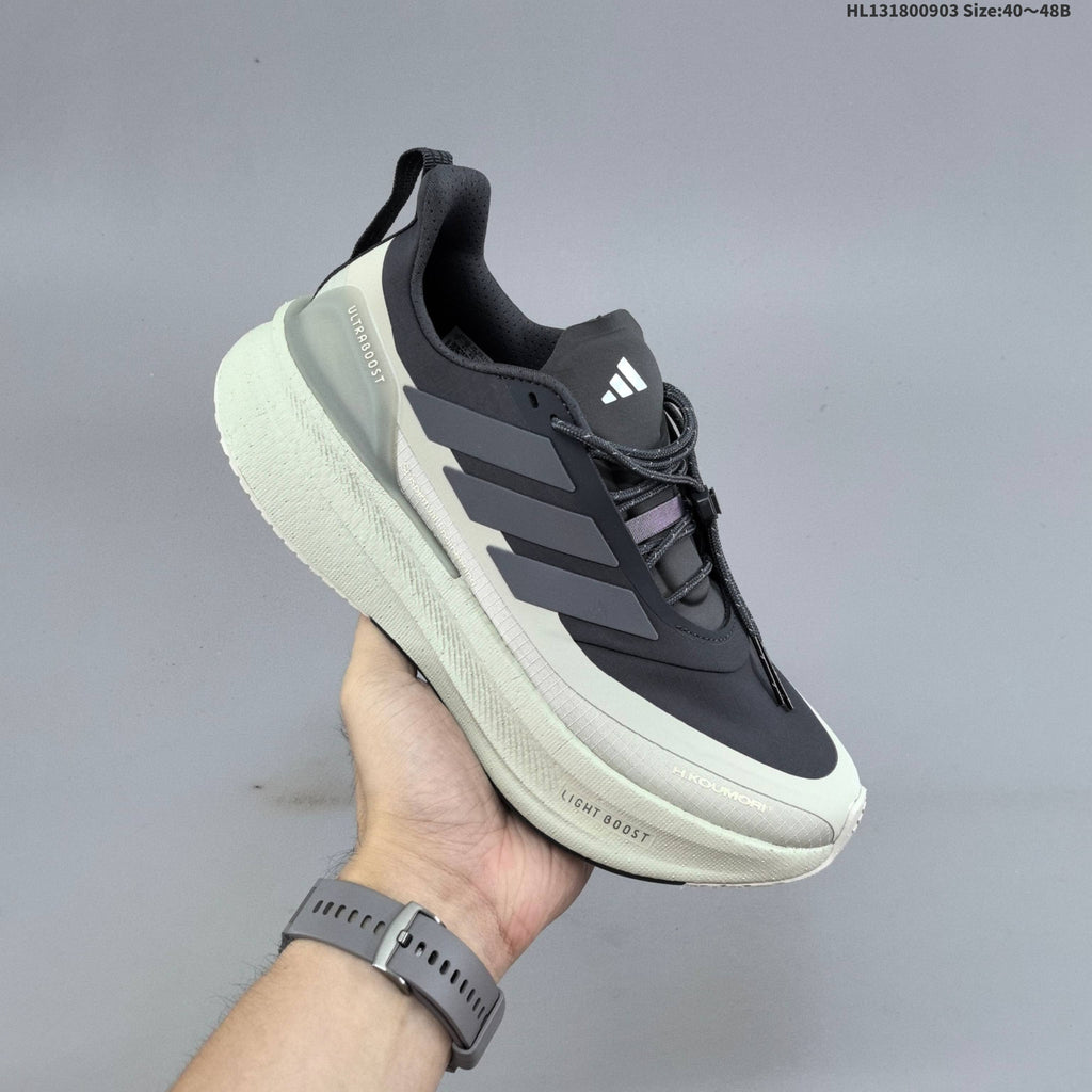 Adidas Ultraboost 5 Running Shoes, in Charcoal and Cream - product image from the listing.