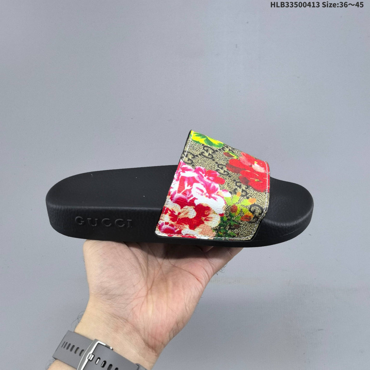 Floral Print Slide Sandals with Black Footbed by Gucci - product image from the listing.