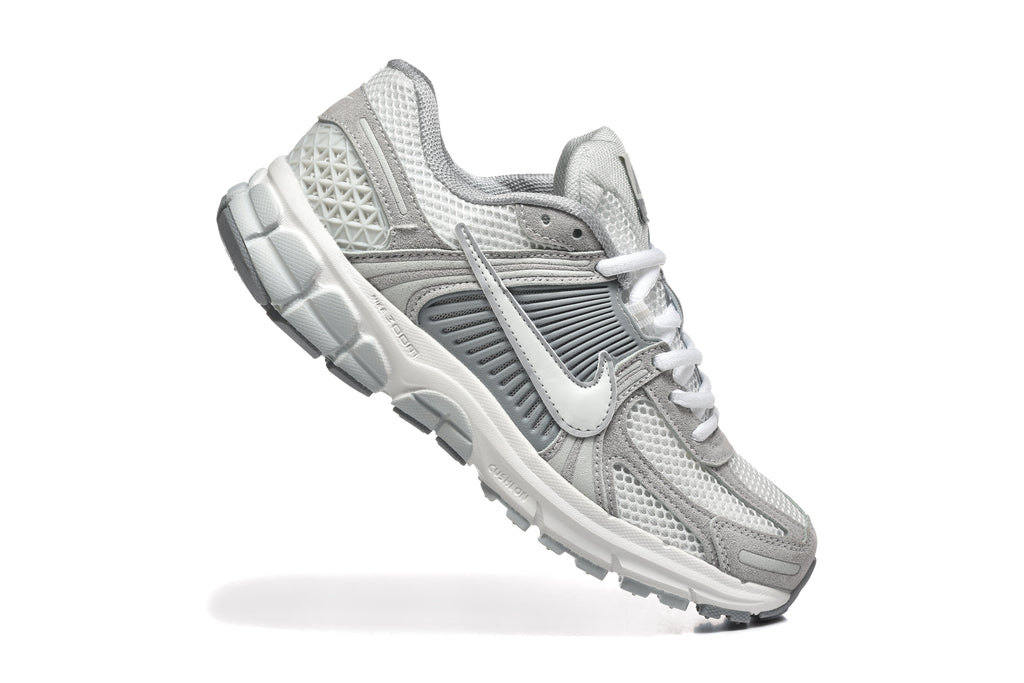 Grey and White Nike Vomero 5 Sneakers - product image from the listing.