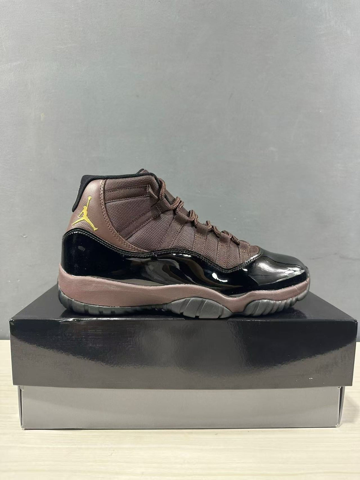 Air Jordan 11 Retro Black Bronze High-Top Sneakers - product image from the listing.
