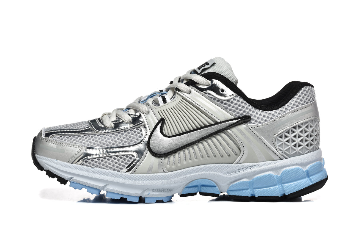 Nike Vomero 5 Sneakers in Silver and Light Blue - product image from the listing.