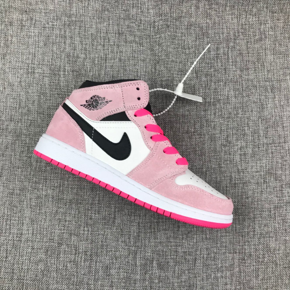 Jordan 1 Mid Sneakers in Pink White Black 852542-801 - product image from the listing.