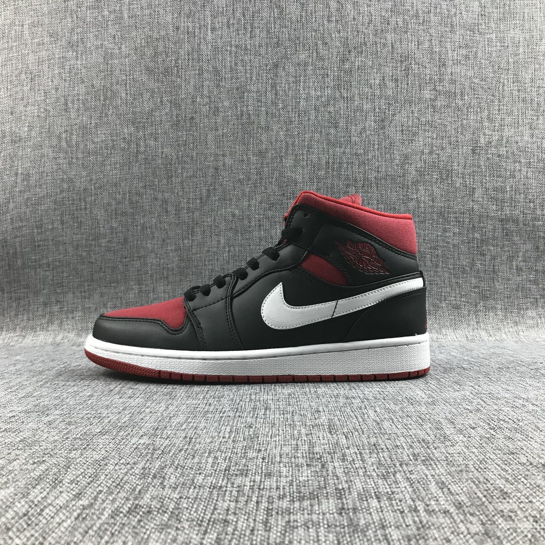 Black Red Canvas-Style Sneakers - Jordan 1 Mid 554724-020 - product image from the listing.