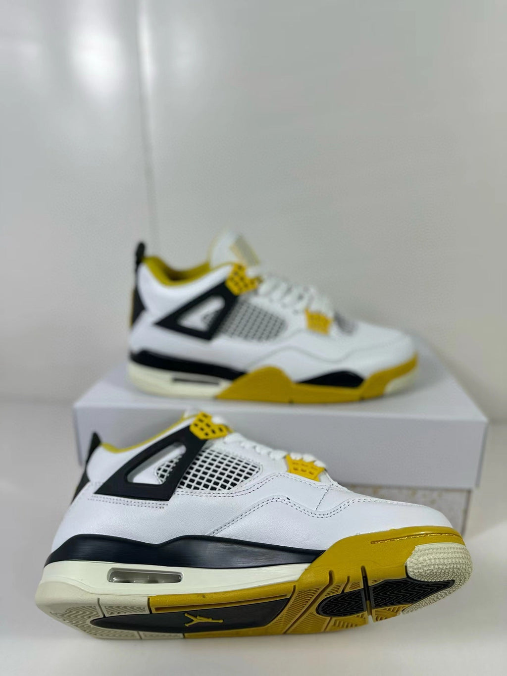 Air Jordan 4 Vivid Sulfur Sneakers White Yellow AQ9129-101 - product image from the listing.
