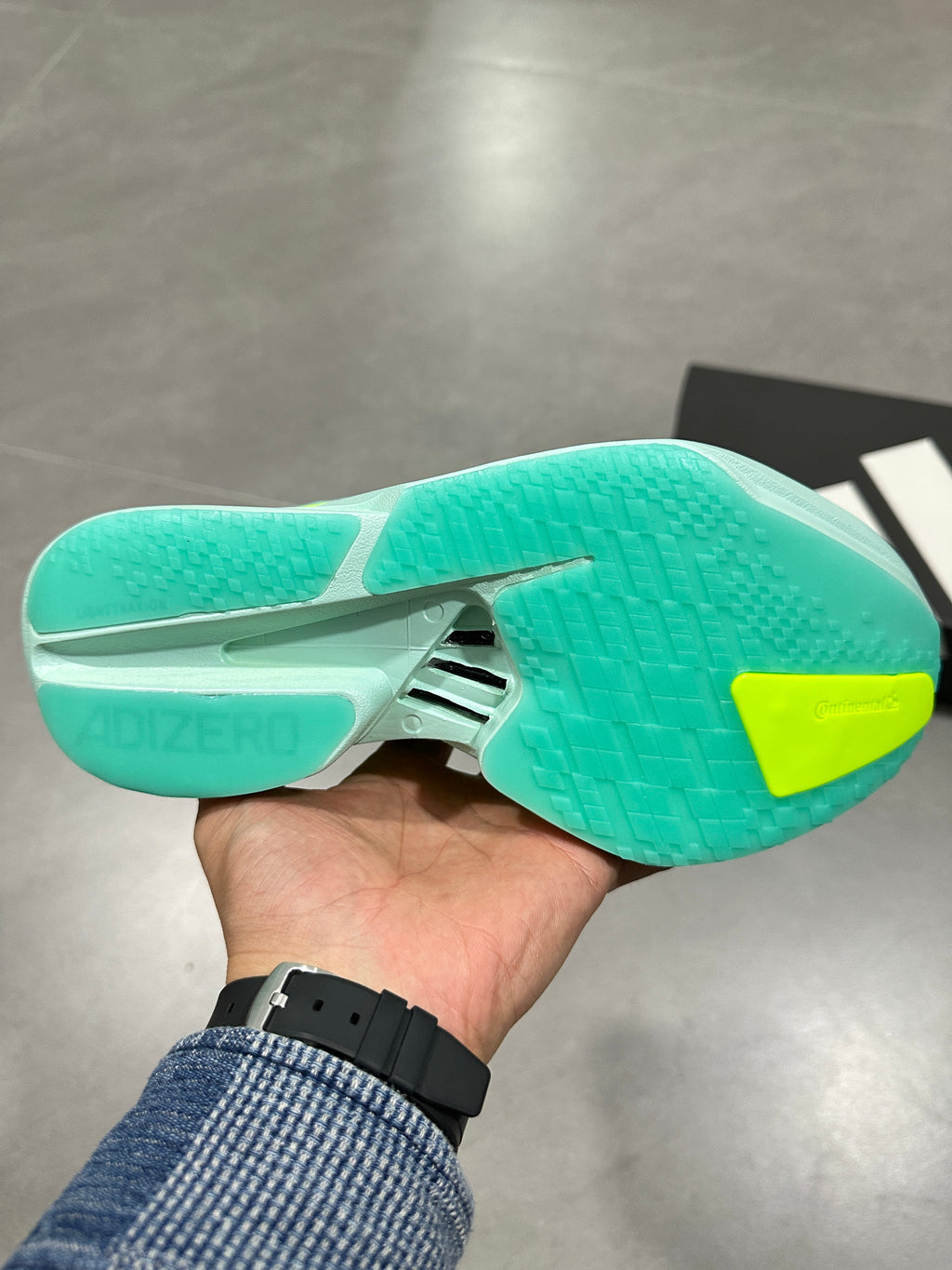 Nike Lightstrike Pro Running Shoes, in Mint Green and Volt - product image from the listing.