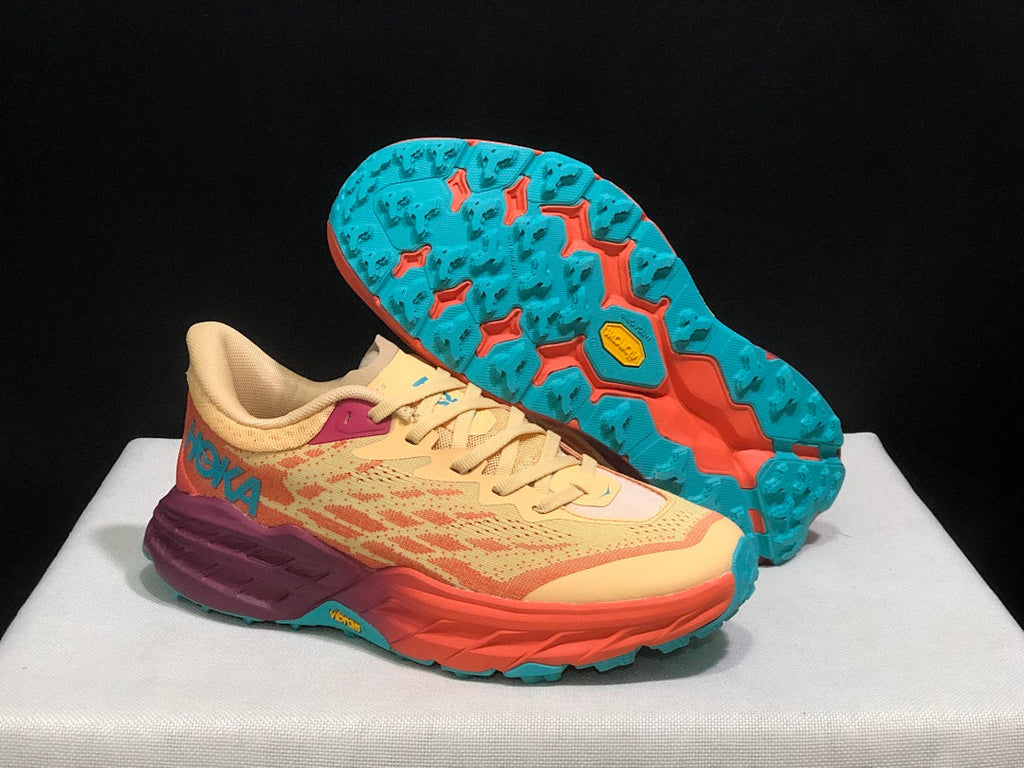 Yellow and Coral HOKA Speedgoat 5 Trail Running Shoes - product image from the listing.