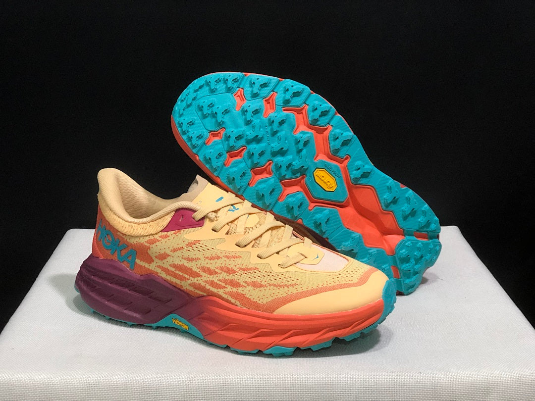 Yellow and Coral HOKA Speedgoat 5 Trail Running Shoes - product image from the listing.