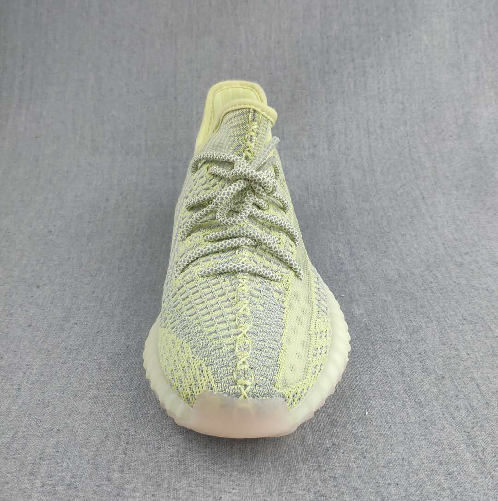 Pale Yellow and Gray Yeezy 350 V2 Knit Sneakers - product image from the listing.