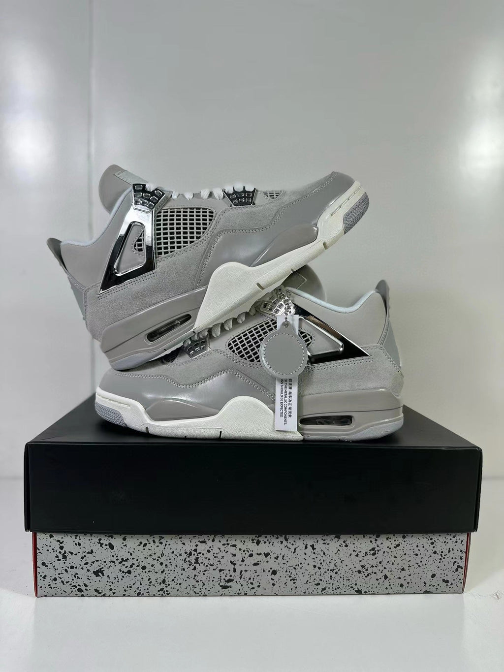 Air Jordan 4 Light Iron Ore Frozen Moments Sneakers - product image from the listing.